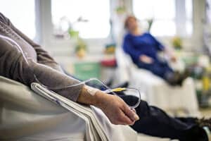 Patients receiving IV therapy in a medical clinic setting.